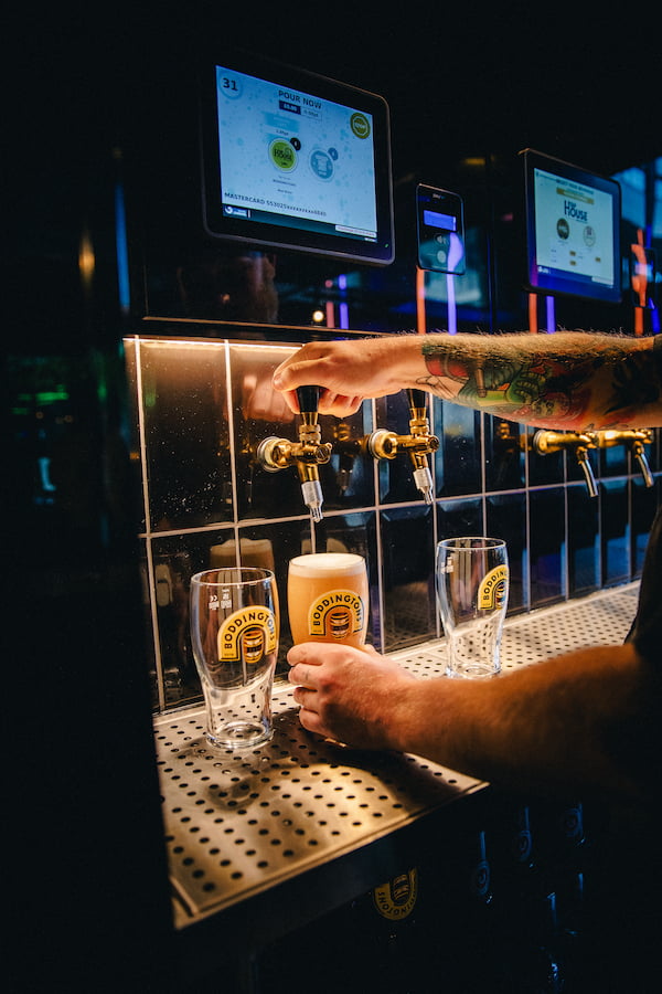 Pouring a beer with the self service beer tap.